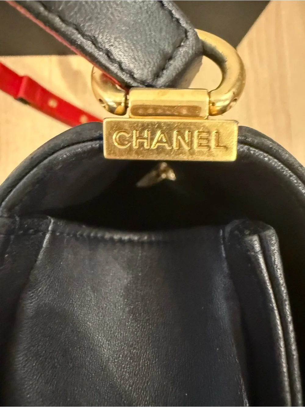 Authentic Chanel Navy Quilted Medium Boy Bag with Red & Gold Accent